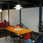 Here's a night shot of the small dining area in the middle of the living room and kitchen.  It's a big open space that serves so many purposes.  The solar shades really help brighten the space at night.  All those windows can make things dark.  We love them.